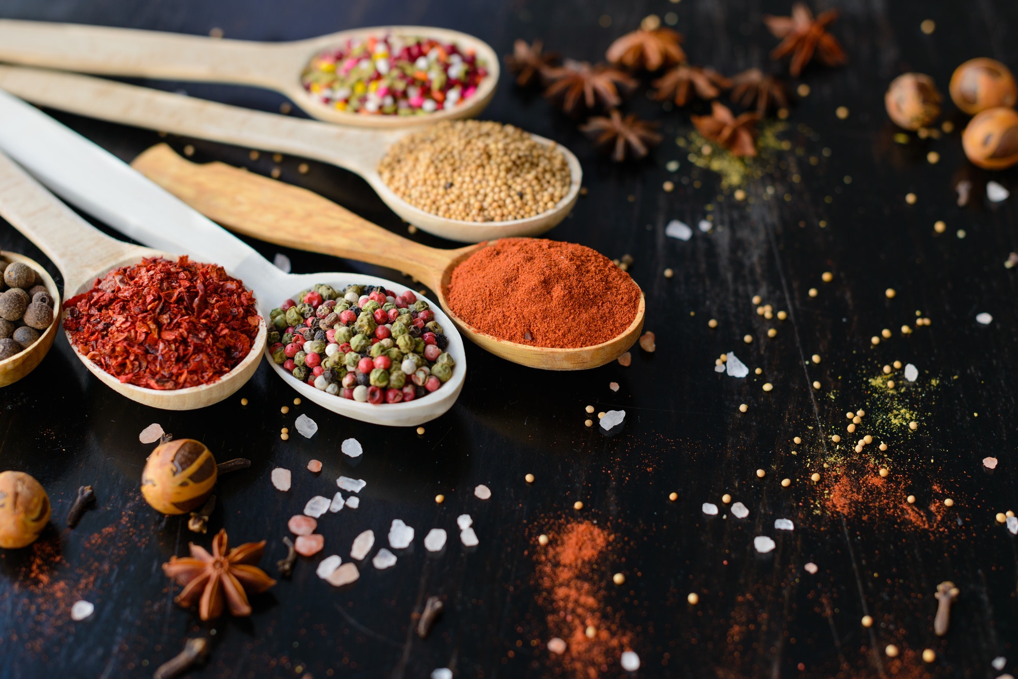 Spices and herbs on old kitchen table